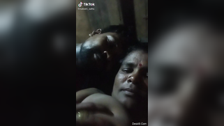 Man plays with his Desi wife's huge boobs in front of XXX camera