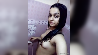 Wet Indian housewife shows her XXX-shaped body in the shower cabin