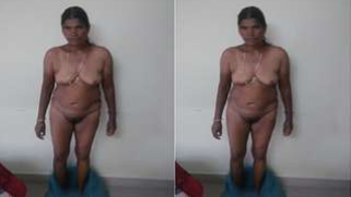 Indian aunty with saggy body stands against the wall posing on camera | XXX Video on AllSex.XXX