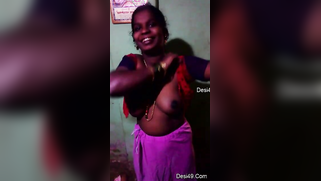 Indian aunty puts red top on hiding saggy titties in amateur XXX video