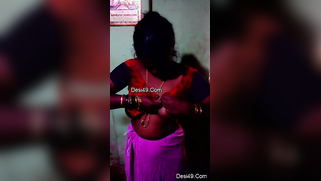 Indian aunty puts red top on hiding saggy titties in amateur XXX video | XXX Video on AllSex.XXX