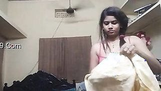 Indian girl wears pink bra and red top on camera in her bedroom | XXX Video on AllSex.XXX