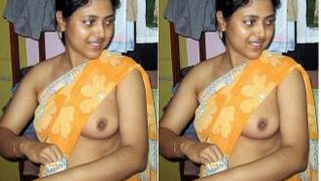 Indian girl with small boobies pulls tank top up exposing her pride