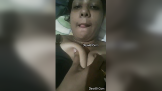 Indian aunty with sexy full lips takes big natural boobs out in bed | XXX Video on AllSex.XXX