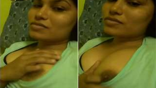 desi mom pulls green T-shirt down and flashes dark nipples in sex show | XXX Video on AllSex.XXX