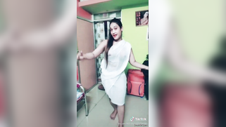 Desi girl in transparent sari dances and sings in short TikTok video | XXX Video on AllSex.XXX