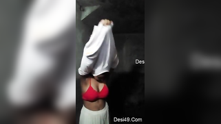 Aunty takes long-sleeve T-shirt and red bra off in empty XXX studio | XXX Video on AllSex.XXX