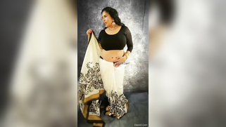 Indian aunty removes black top and pulls bra down taking hooters out