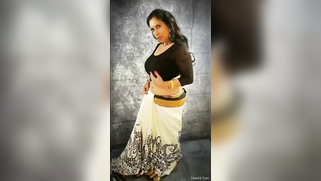 Indian aunty removes black top and pulls bra down taking hooters out | XXX Video on AllSex.XXX