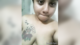 Desi possessor of a tattoo on right breast wants everybody to see it