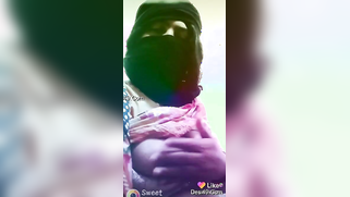 Desi is smart enough to put on a balaclava before exposing boobs