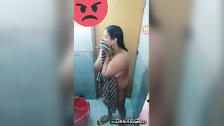 Hidden camera video of the unsuspecting Indian taking a bath