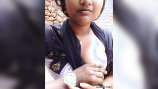 Amateur outdoor video of the mustached Indian licking girl's nipples