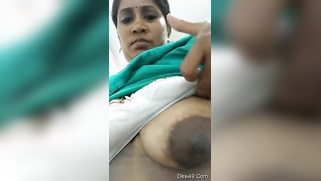 Married aunty exposes her saggy Indian boobs with huge nipples