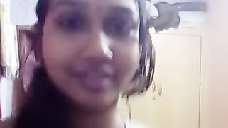 Naughty Desi teeny strips nude and teases her XXX pussy for the cam