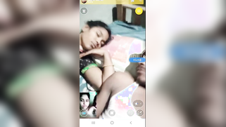 Lustful male plays with his Indian girlfriend's XXX tits on the bed