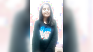 Indian minx gets naked and spreads legs to stretch pussy with fingers