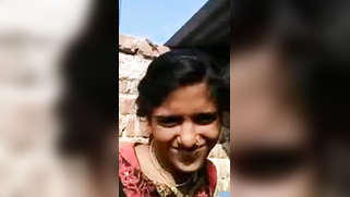 Indian babe sits under blazing sun and lifts clothes up to expose all