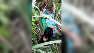 Voyeur spies on young Desi couple who fools around on a grass field