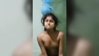 Slim Desi teen with small tits riding boyfriend's dick in bathroom