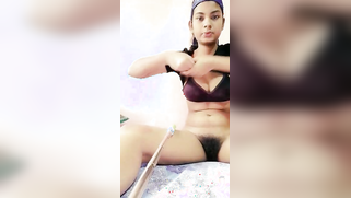 Indian minx using selfie stick to show lover her hairy XXX snatch