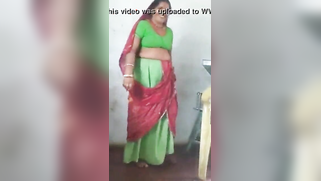 Joyful Desi woman lifts green dress to demonstrate hairy vagina | XXX Video on AllSex.XXX