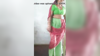 Joyful Desi woman lifts green dress to demonstrate hairy vagina | XXX Video on AllSex.XXX