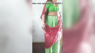 Joyful Desi woman lifts green dress to demonstrate hairy vagina | XXX Video on AllSex.XXX