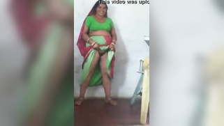 Joyful Desi woman lifts green dress to demonstrate hairy vagina | XXX Video on AllSex.XXX