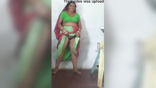 Joyful Desi woman lifts green dress to demonstrate hairy vagina | XXX Video on AllSex.XXX