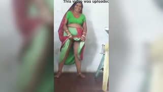 Joyful Desi woman lifts green dress to demonstrate hairy vagina | XXX Video on AllSex.XXX