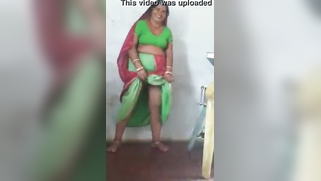 Joyful Desi woman lifts green dress to demonstrate hairy vagina | XXX Video on AllSex.XXX