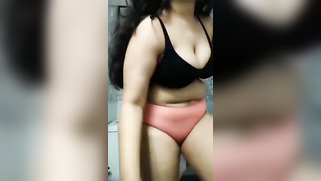 Long-haired Indian chick plays with succulent XXX melons on camera