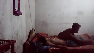 Camera is opposite the bed on which Indian lovers enjoy XXX fun