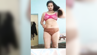 Indian charmer takes striped dress off and keeps on doing XXX show