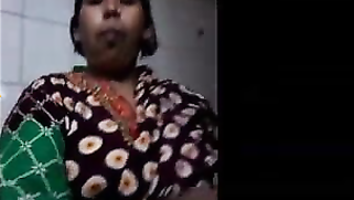 Indian possessor of natural hooters takes them to light in XXX porn