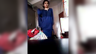 Hidden camera films XXX video of chubby slowly taking blue sari off