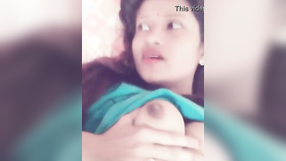 Half-naked Mallu lies on bed and films her naked boobies in XXX porn