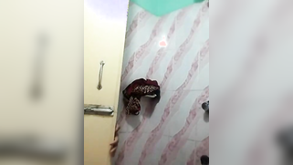 Comely Indian aunty seductively washes XXX assets in front of cam