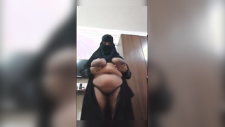 Scandalous XXX porn! Horny Arab MILF in Hijab Fingers Her Hairy Pussy for the Cam! | XXX Video on AllSex.XXX